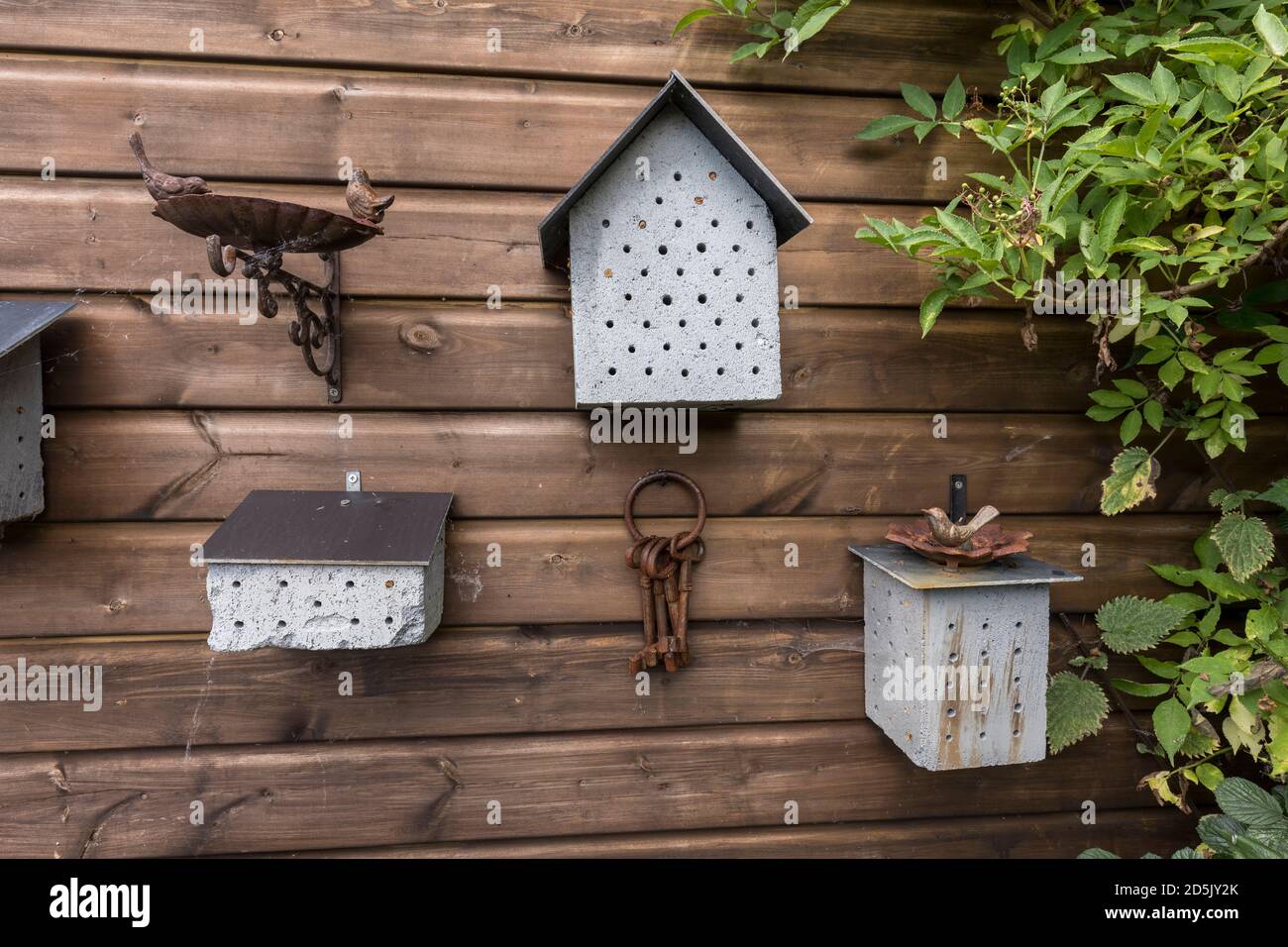 Insect Houses; with Garden Ornaments; UK Stock Photo