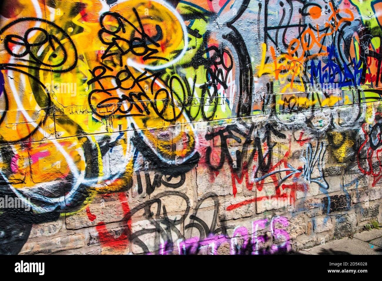 Colourful graffiti on a wall. Stock Photo