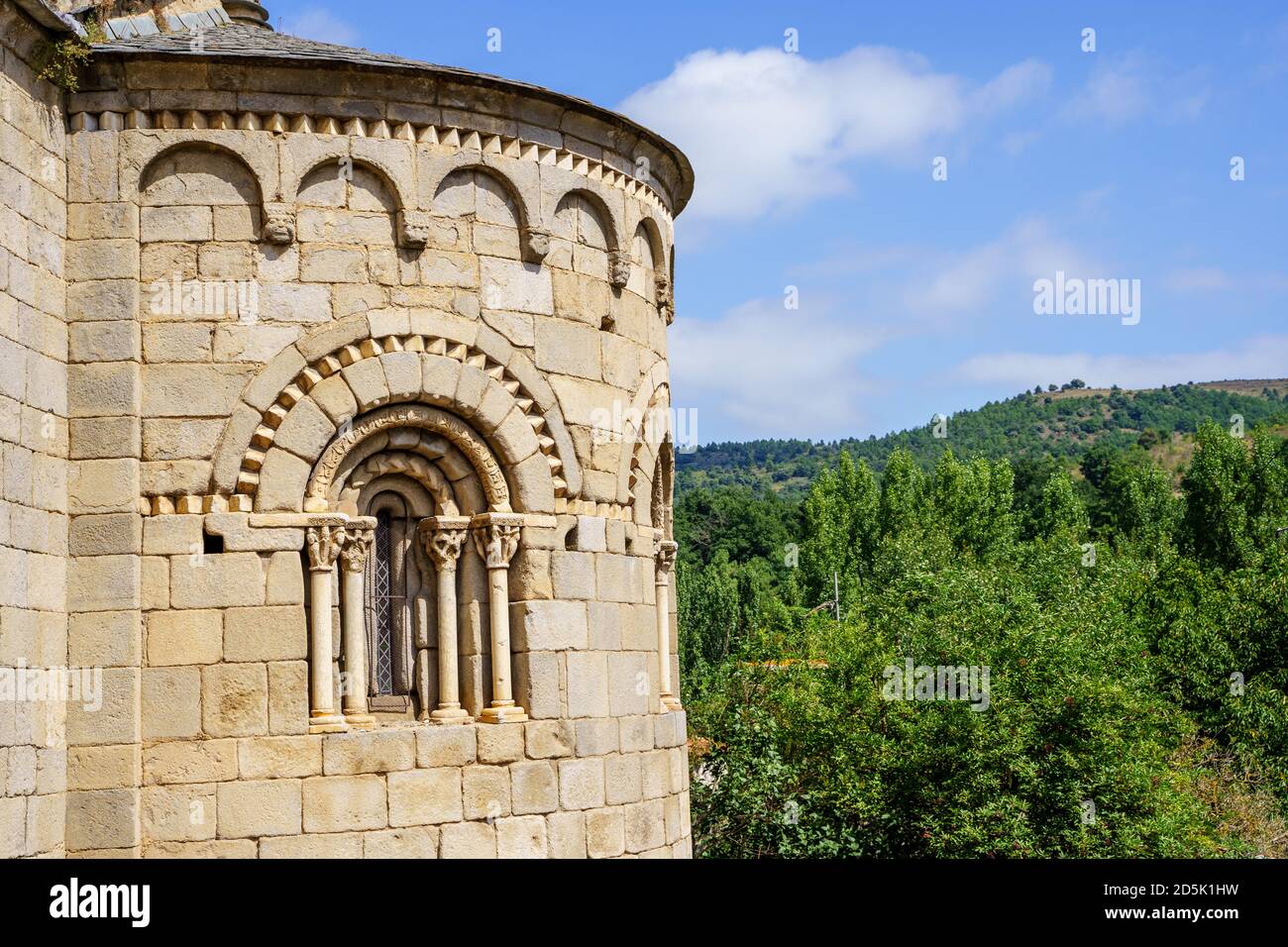 Facade of a medieval stone castle with arches on it and the mountain on the background. Villefranche de conflent in France Stock Photo