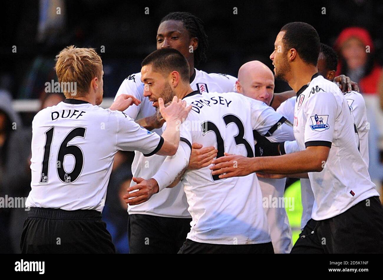 Fulham's Clint Dempsey (centre) celebrates with his team mates after scoring his side's second goal of the game from the penalty spot Stock Photo