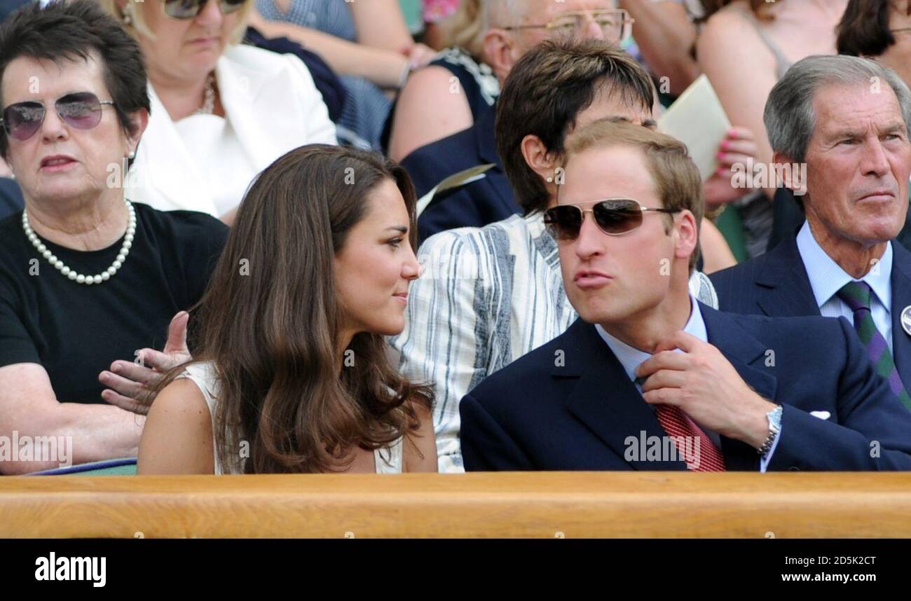 The Duke and Duchess of Cambridge in the Royal Box during the match between Great Britain's Andy Murray and France's Richard Gasquet on Centre Court during day seven of the 2011 Wimbledon Championships at the All England Lawn Tennis and Croquet Club, Wimbledon. Stock Photo