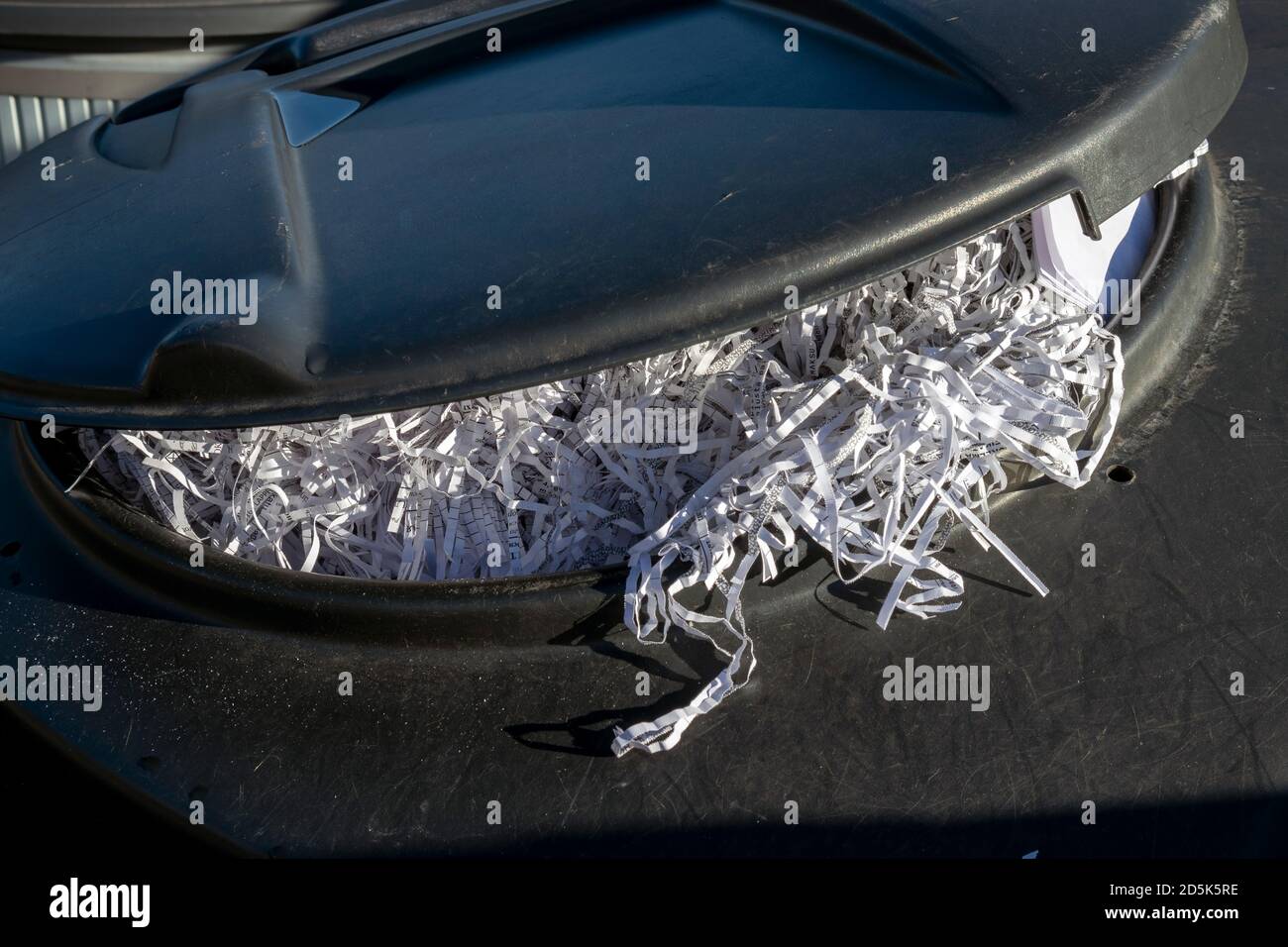 recycling bin full of shredded paper Stock Photo Alamy