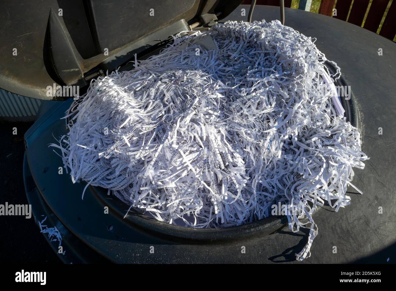 recycling bin full of shredded paper Stock Photo Alamy