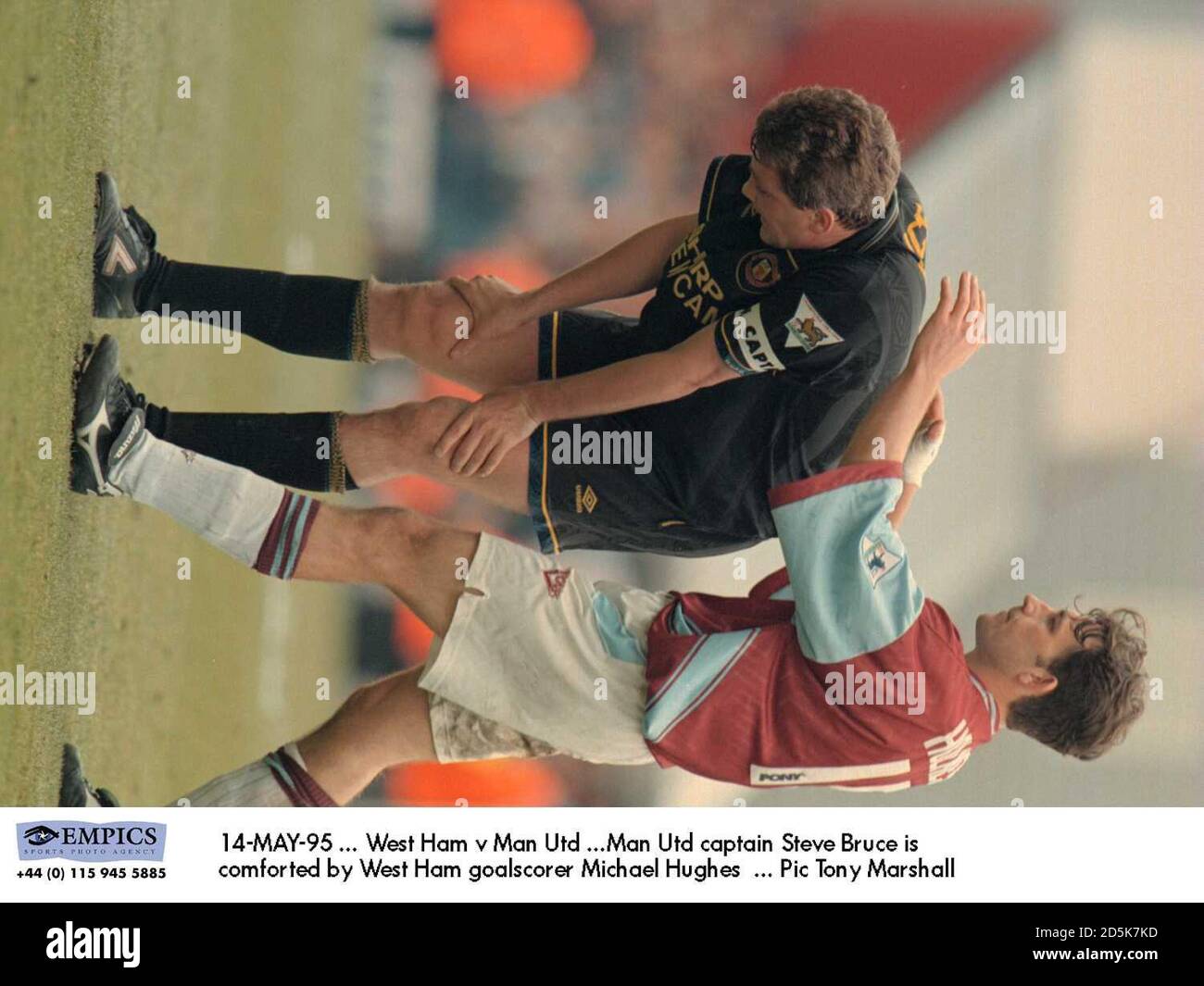 14-MAY-95 ... West Ham v Manchester United ...Manchester United captain Steve Bruce is comforted by West Ham goalscorer Michael Hughes Stock Photo