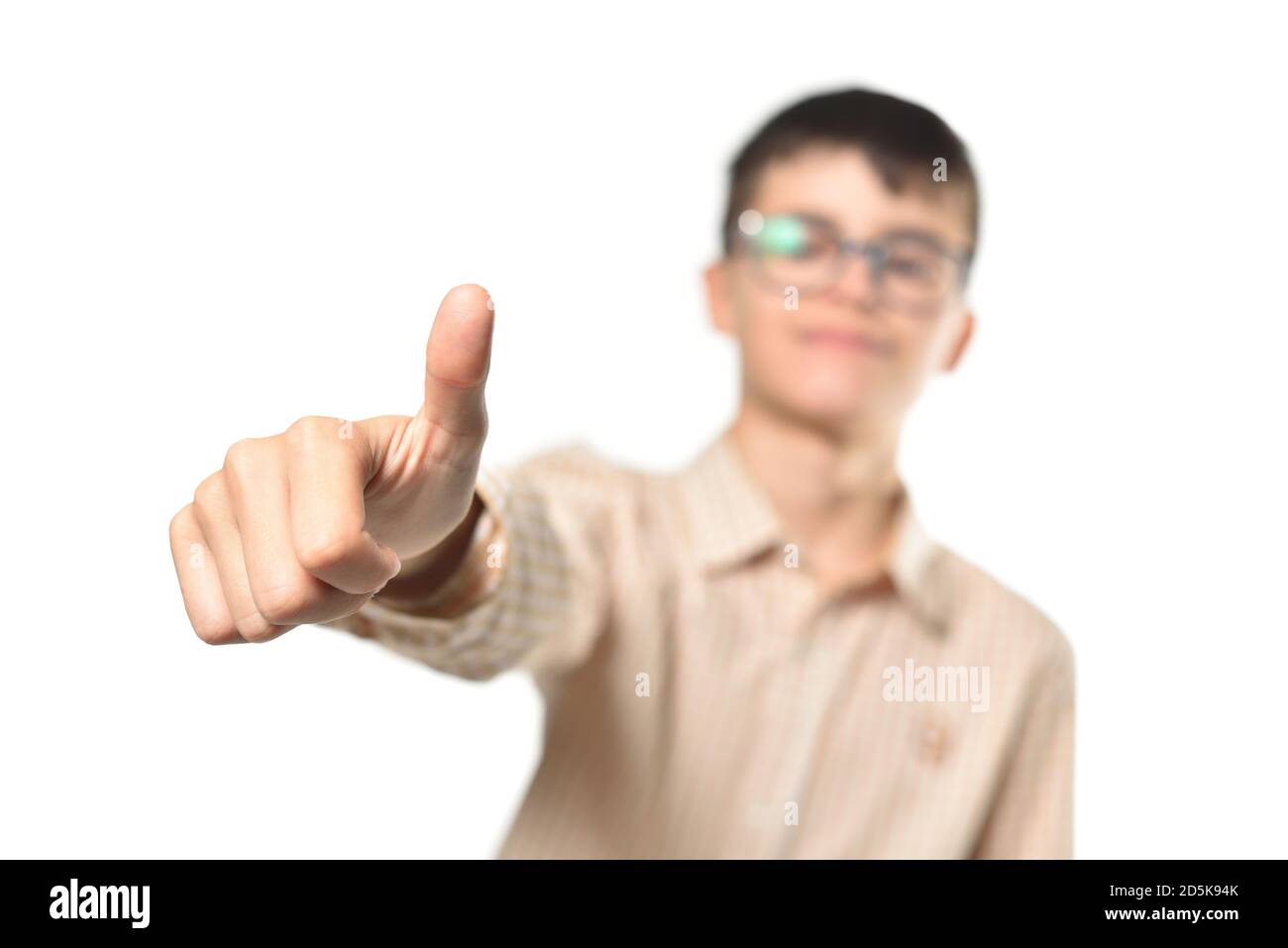 Teenager boy with glasses showing thumbs up gesture on white background Stock Photo