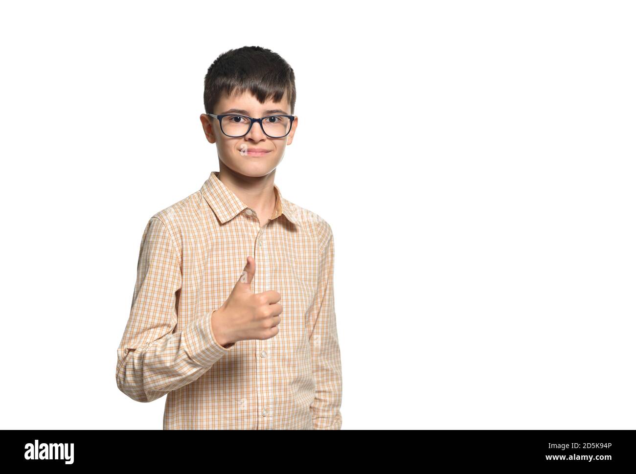 Cute caucasian white boy wearing glasses showing thumbs up on white isolated background Stock Photo