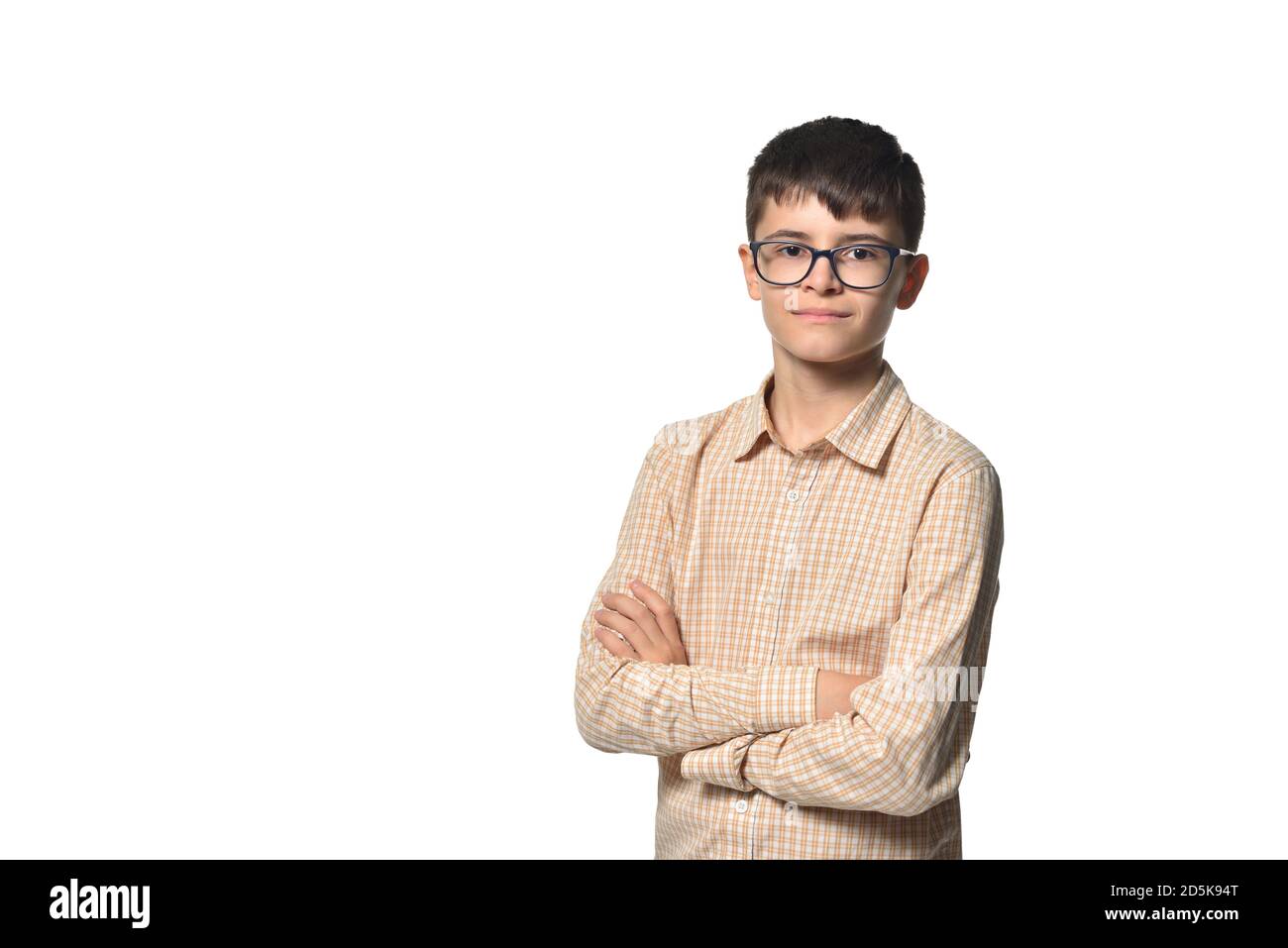 Portrait of a school-age boy confidently looking at the camera and smiling Stock Photo