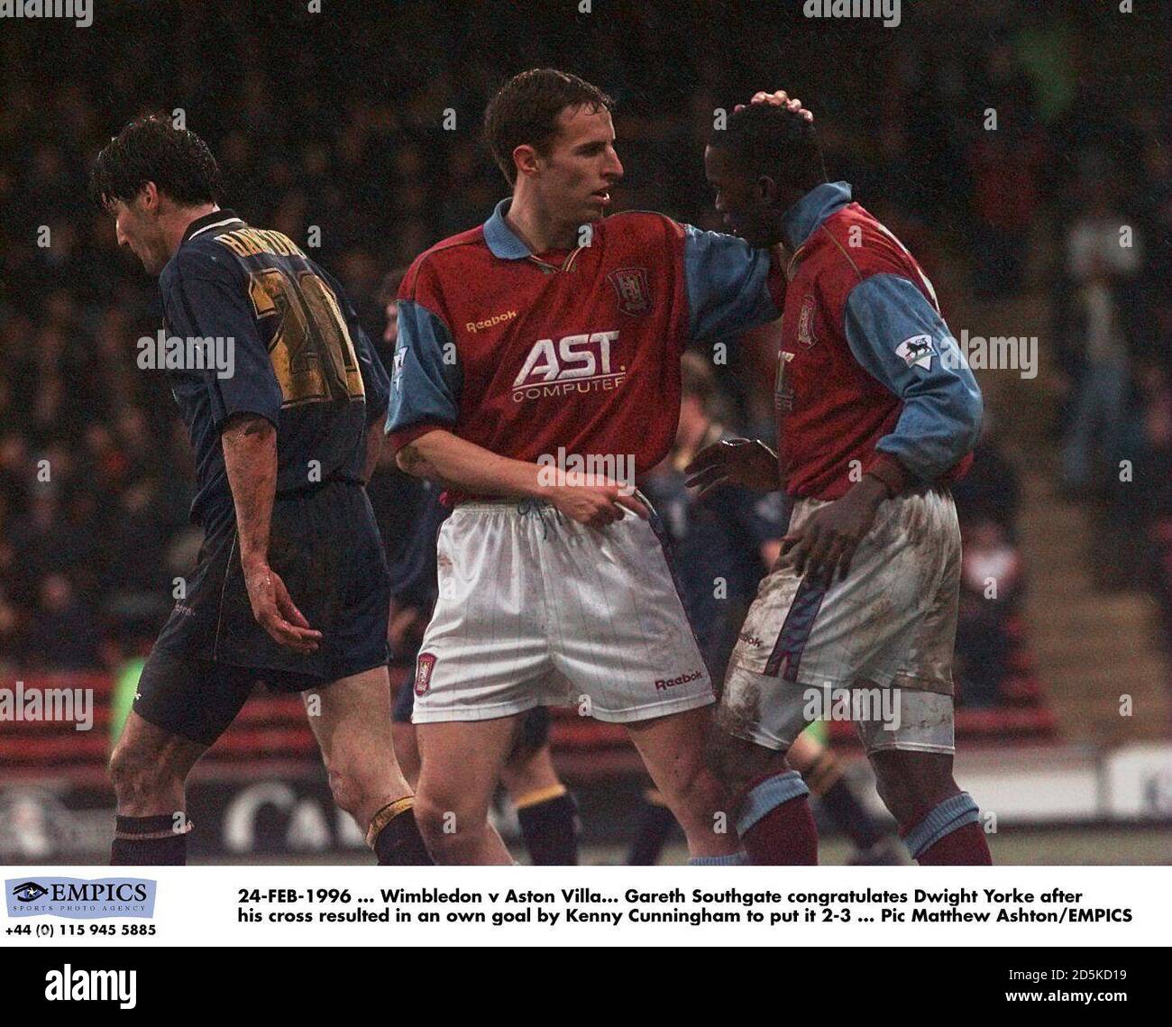 24-FEB-1996 ... Wimbledon v Aston Villa.  Gareth Southgate (left) congratulates Dwight Yorke after his cross resulted in an own goal by Kenny Cunningham Stock Photo