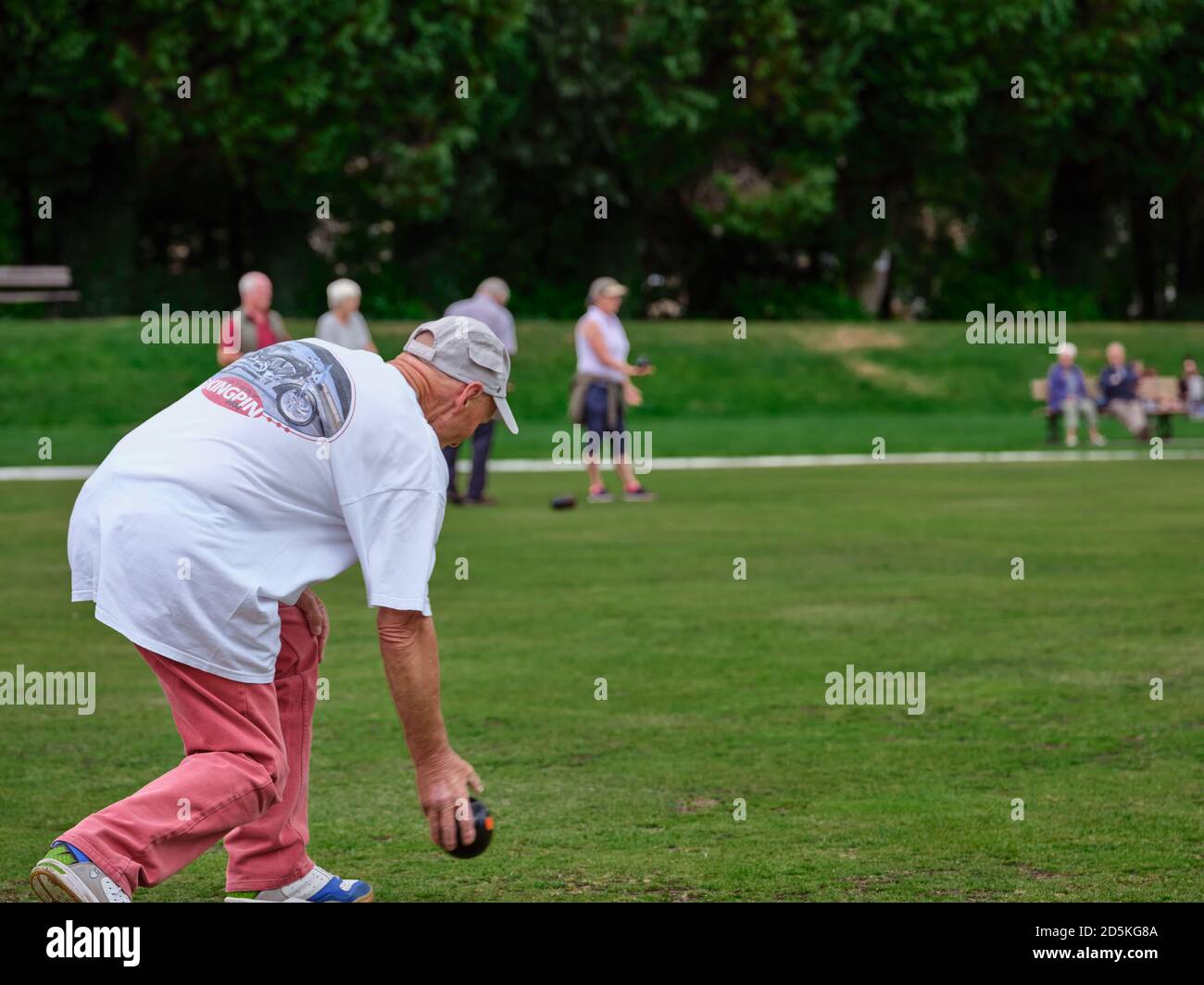 In July, a lone competitor takes time to practice bowls on the crown green at Pateley Bridge, Harrogate, North Yorkshire, England, UK. 21/07/2019. Stock Photo