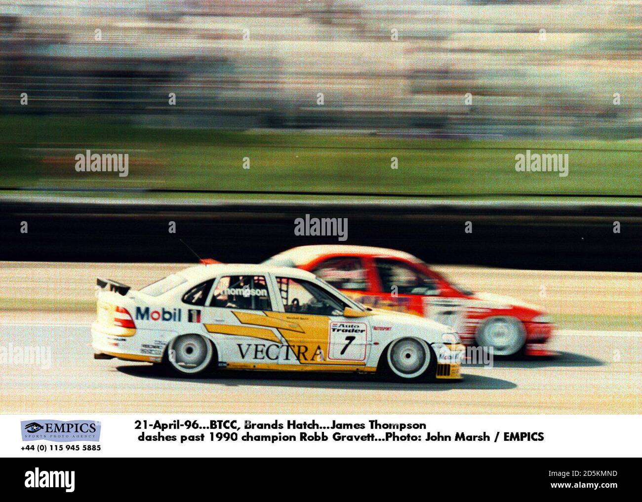 21-April-96. BTCC, Brands Hatch. James Thompson dashes past 1990 champion Robb Gravett Stock Photo