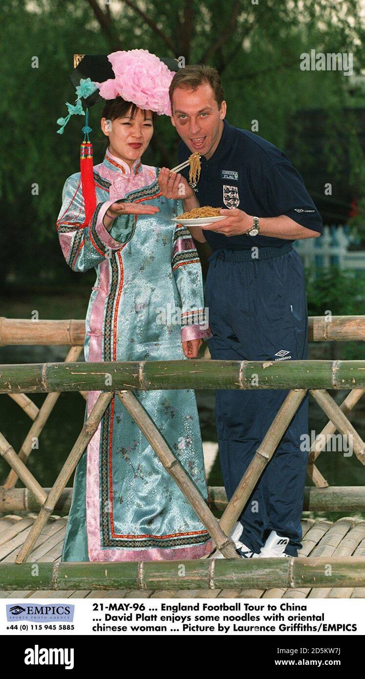 David Platt enjoys noodles with an Oriental Chinese Woman Stock Photo