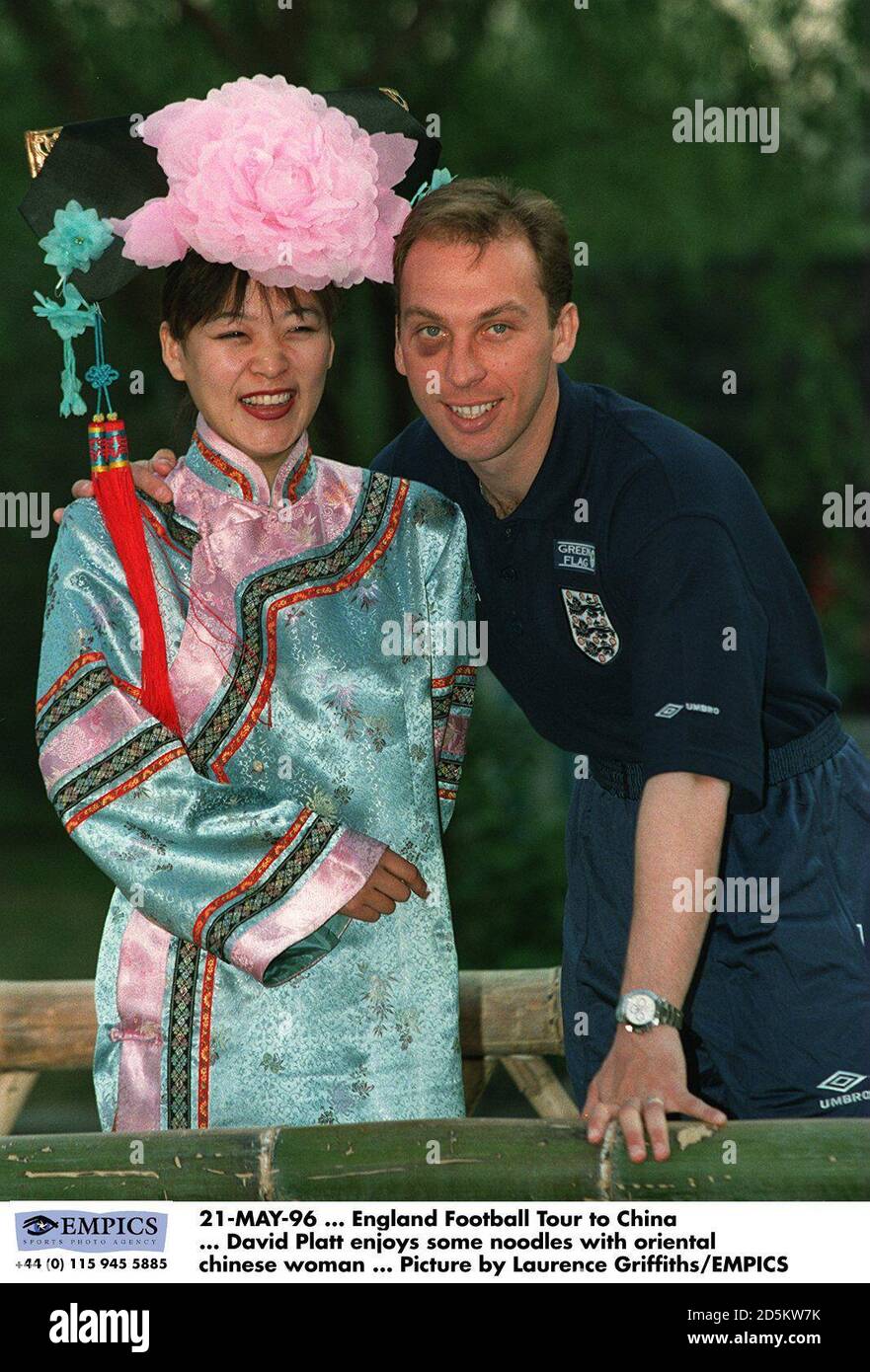 David Platt enjoys some noodleswith Oriental Chinese Woman Stock Photo