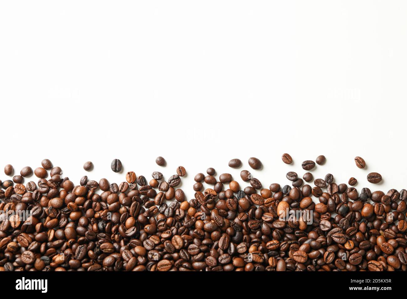 Roasted coffee beans on white background, space for text Stock Photo ...
