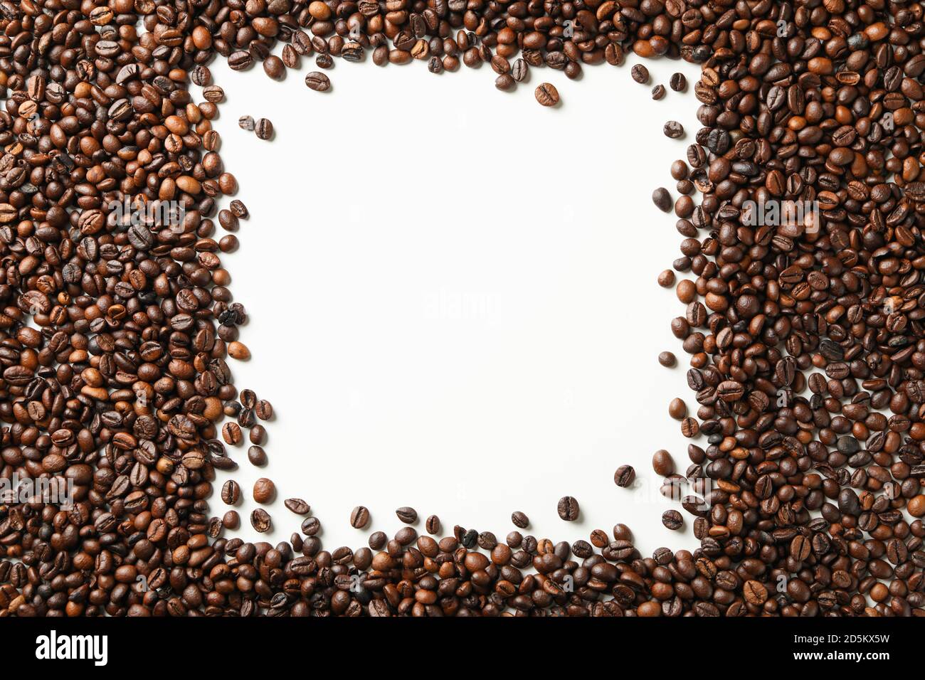 Roasted coffee beans on white background, space for text Stock Photo ...