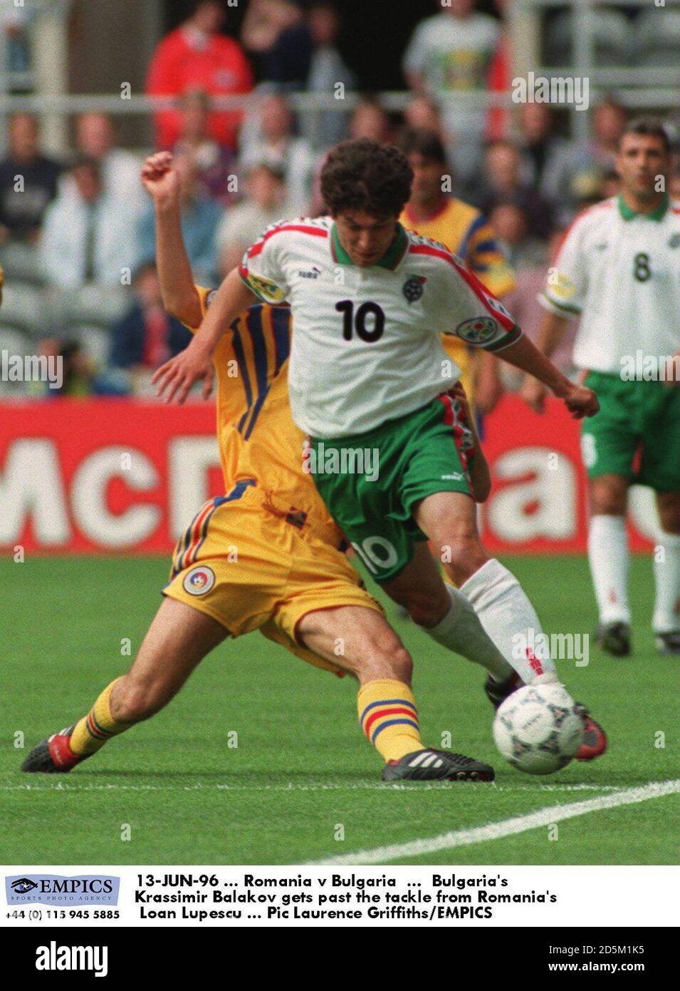 13-JUN-96 ...  Romania v Bulgaria  ...  Bulgaria's Krassimir Balakov gets past the tackle from Romania's Loan Lupescu Stock Photo