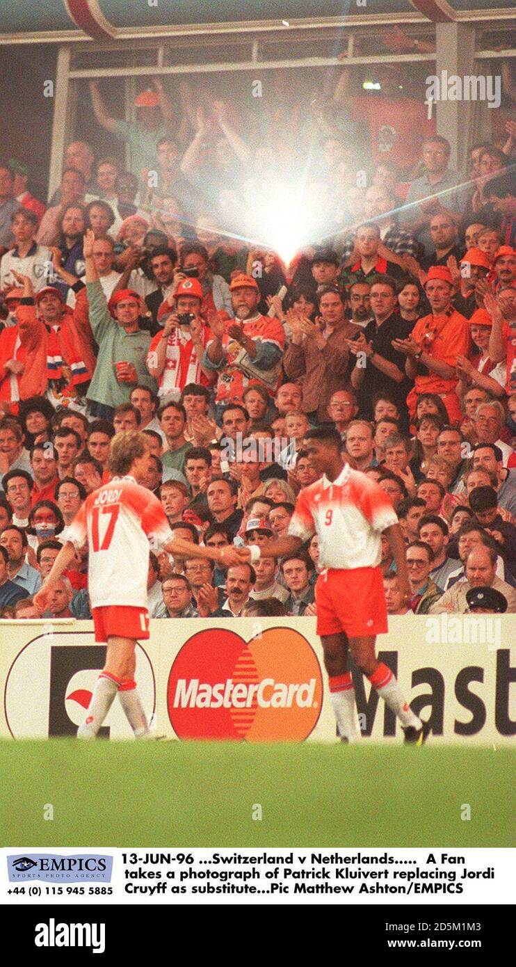 13-JUN-96 ...Switzerland v Netherlands.   A Fan takes a photograph of Patrick Kluivert replacing Jordi Cruyff as substitute Stock Photo