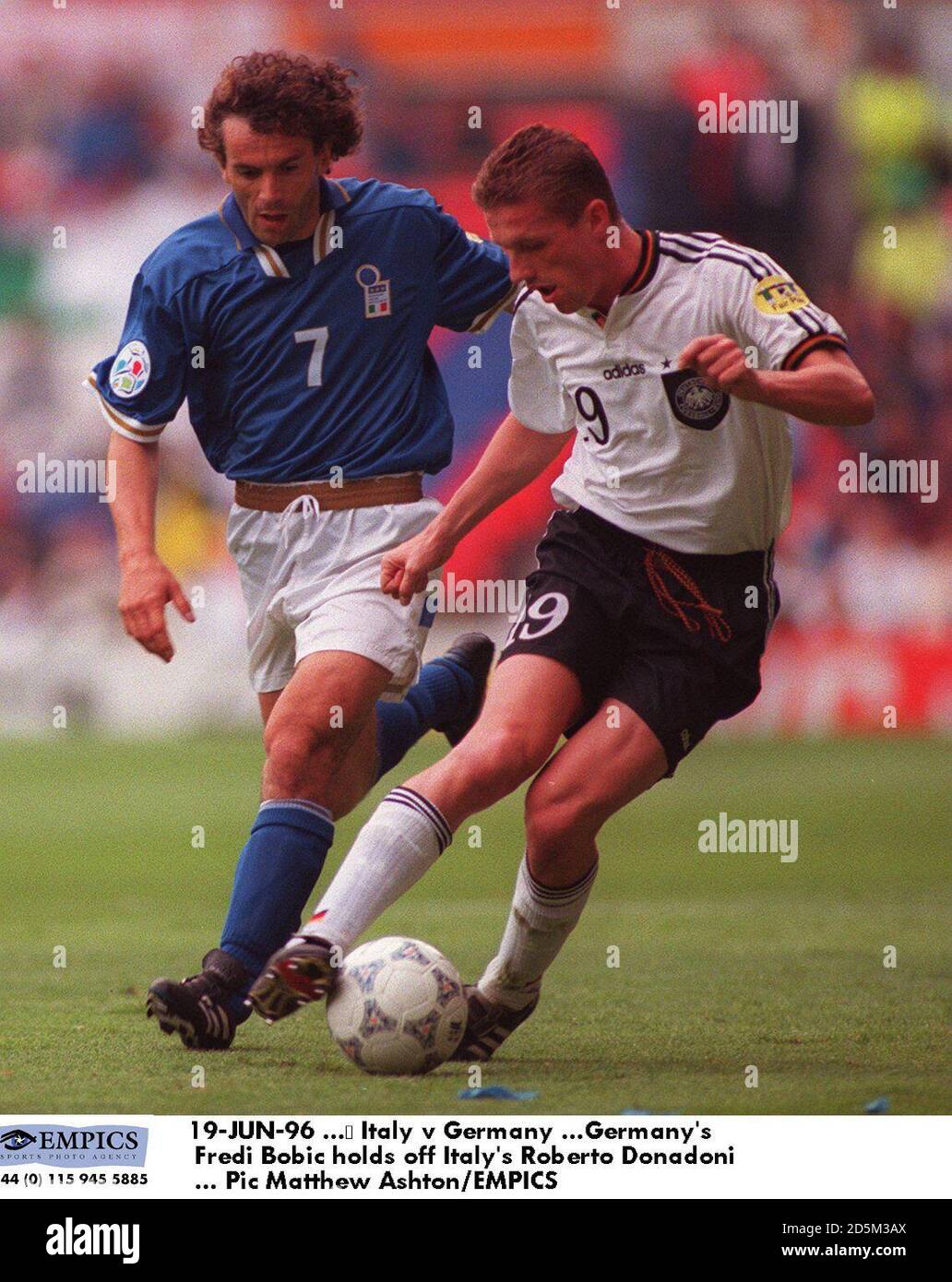 19-JUN-96 ...  Italy v Germany ...Germany's Thomas Strunz holds off Italy's Roberto Donadoni Stock Photo