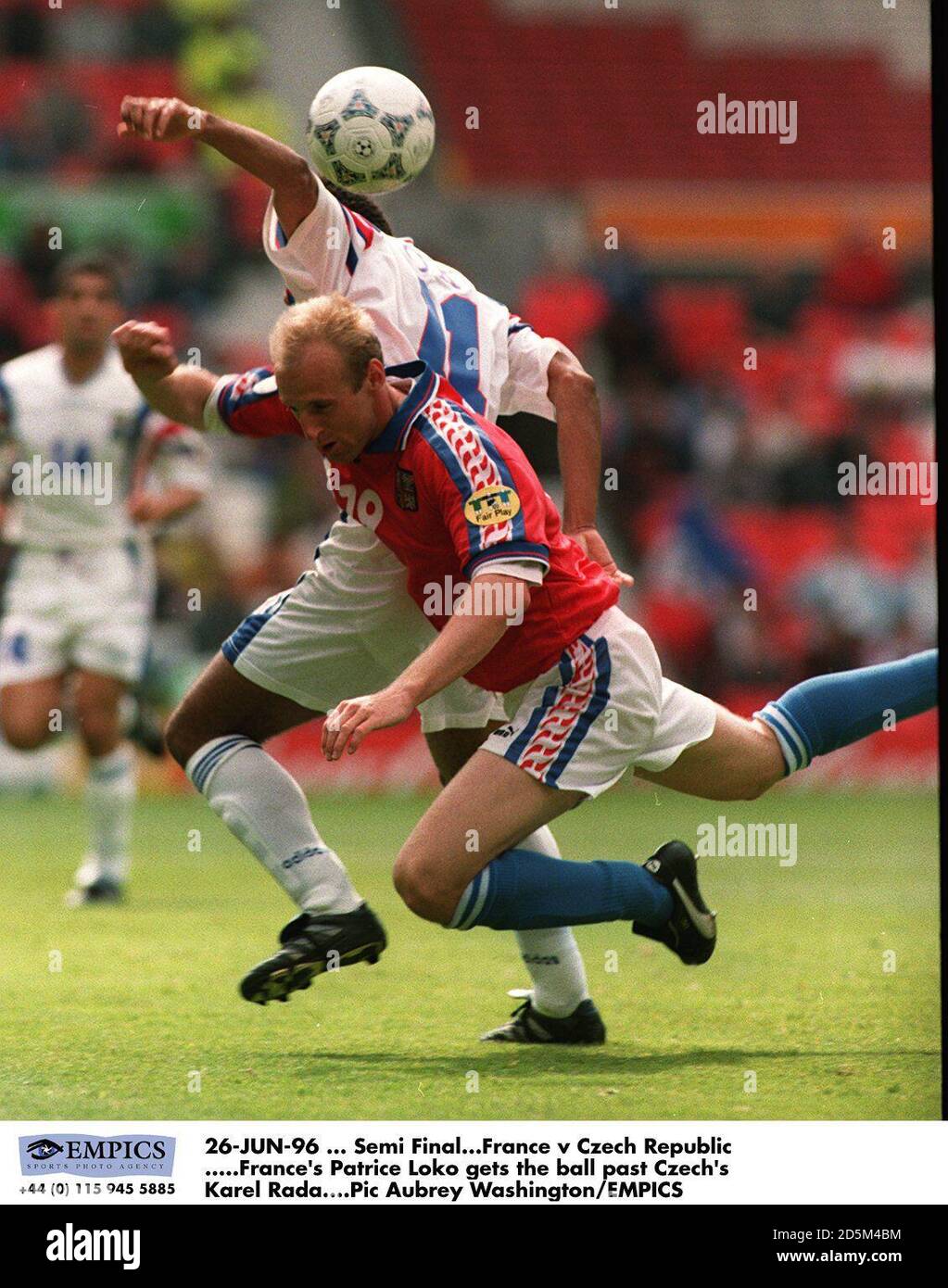 26-JUN-96 ... Semi Final. France v Czech Republic. France's Patrice Loko gets the ball past Czech's Karel Rada Stock Photo