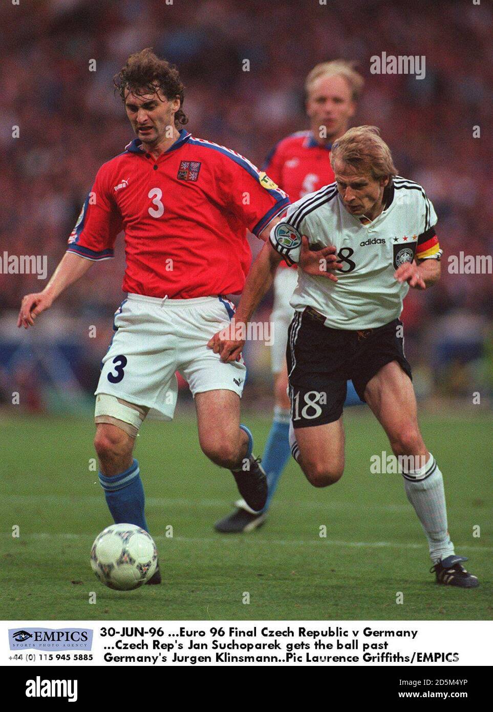 Czech Rep's Jan Suchoparek gets the ball past Germany's Jurgen Klinsmann Stock Photo