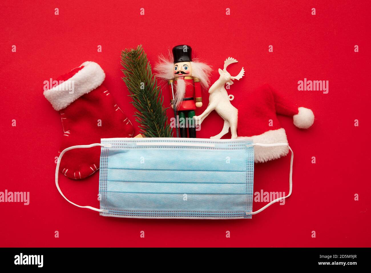 Christmas tree with decorations and surgical mask. Covid 19 pandemic.  Geneva. Switzerland Stock Photo - Alamy