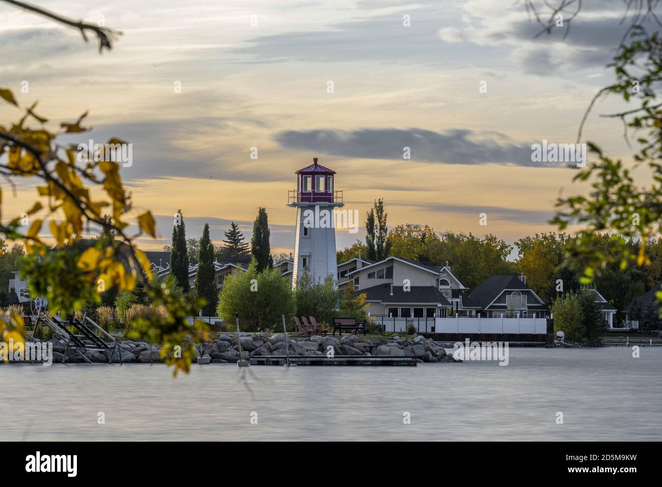 Beautiful shot of the coast with a lighthouse near Sylvan Lake in Alberta, Canada Stock Photo