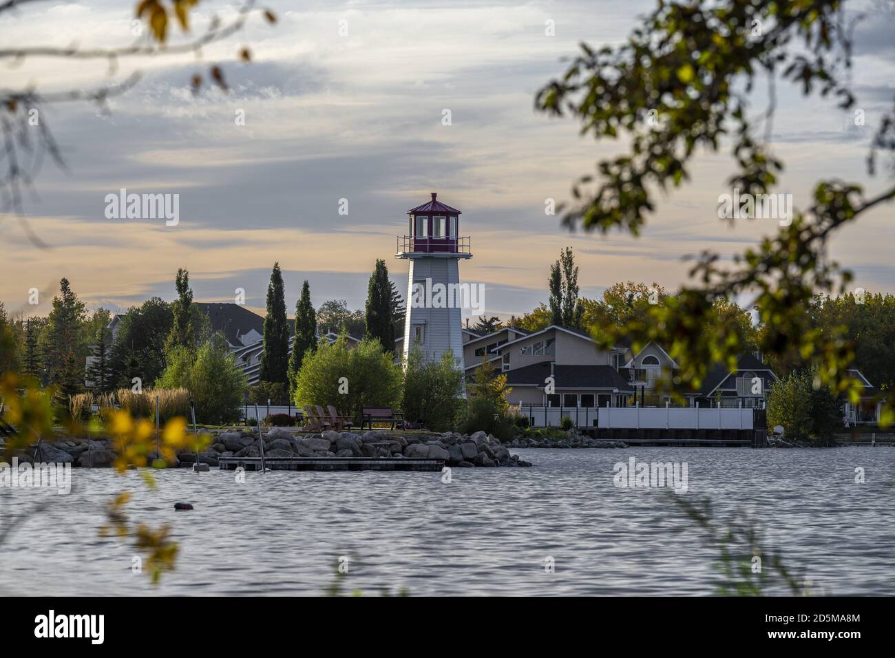 Beautiful shot of the coast with a lighthouse near Sylvan Lake in Alberta, Canada Stock Photo