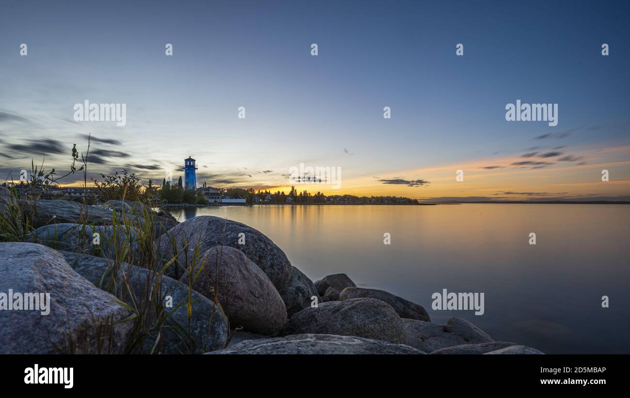 Beautiful shot of the rocky coast during sunset near Sylvan Lake in Alberta, Canada Stock Photo