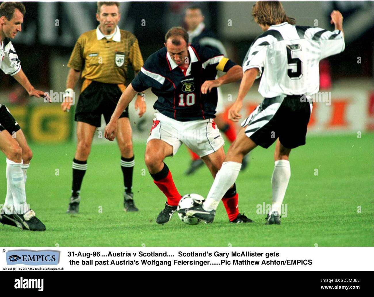 Scotland's Gary McAllister (centre) is tackled by Austria's Wolfgang Feiersinger (right) Stock Photo