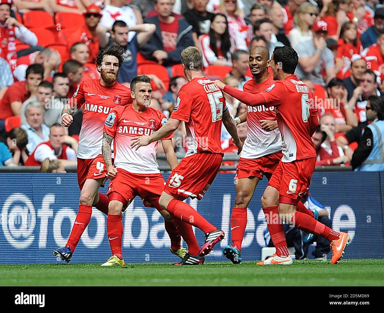 Leyton Orient's Dean Cox (left) celebrates scoring his teams second goal of the game with teammates Stock Photo