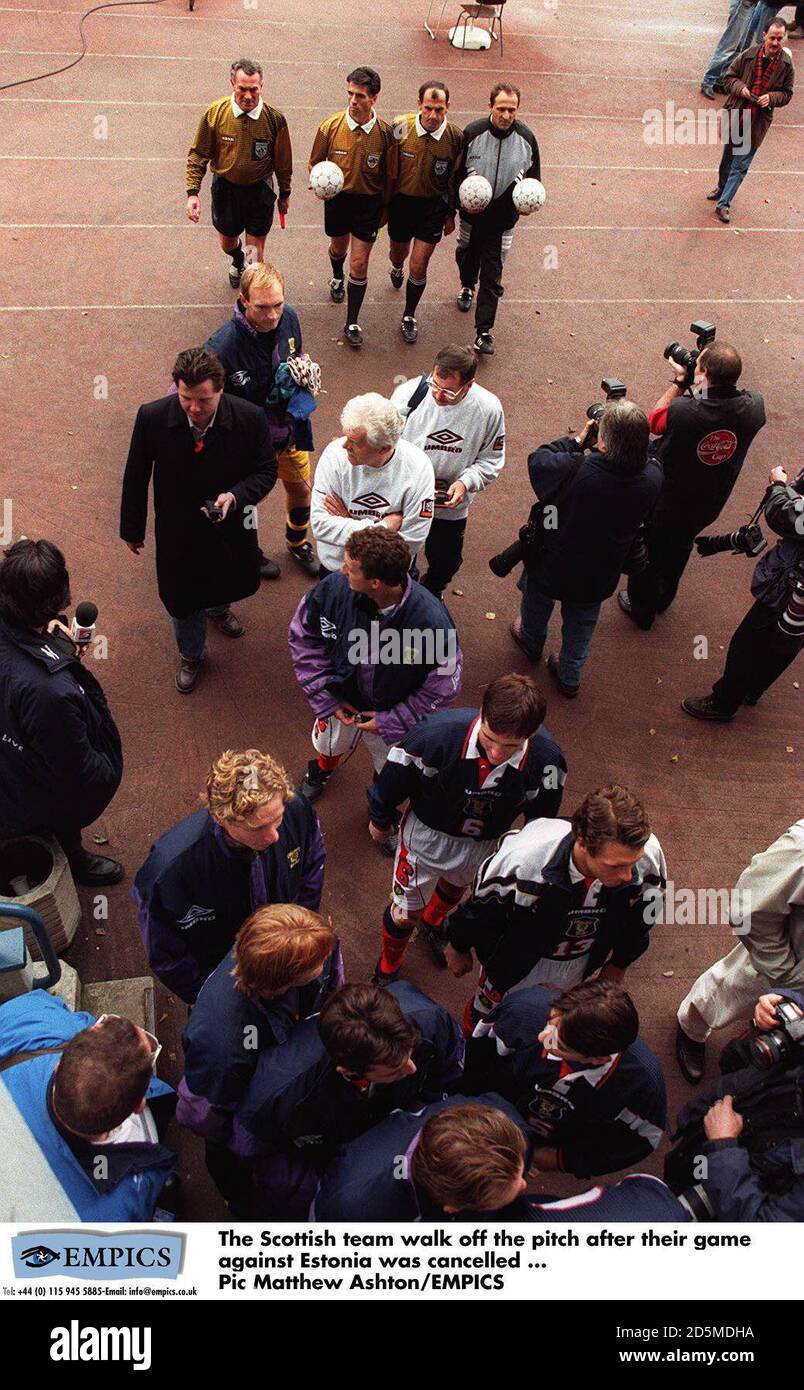 The Scottish team walk off the pitch after their game against Estonia was cancelled Stock Photo
