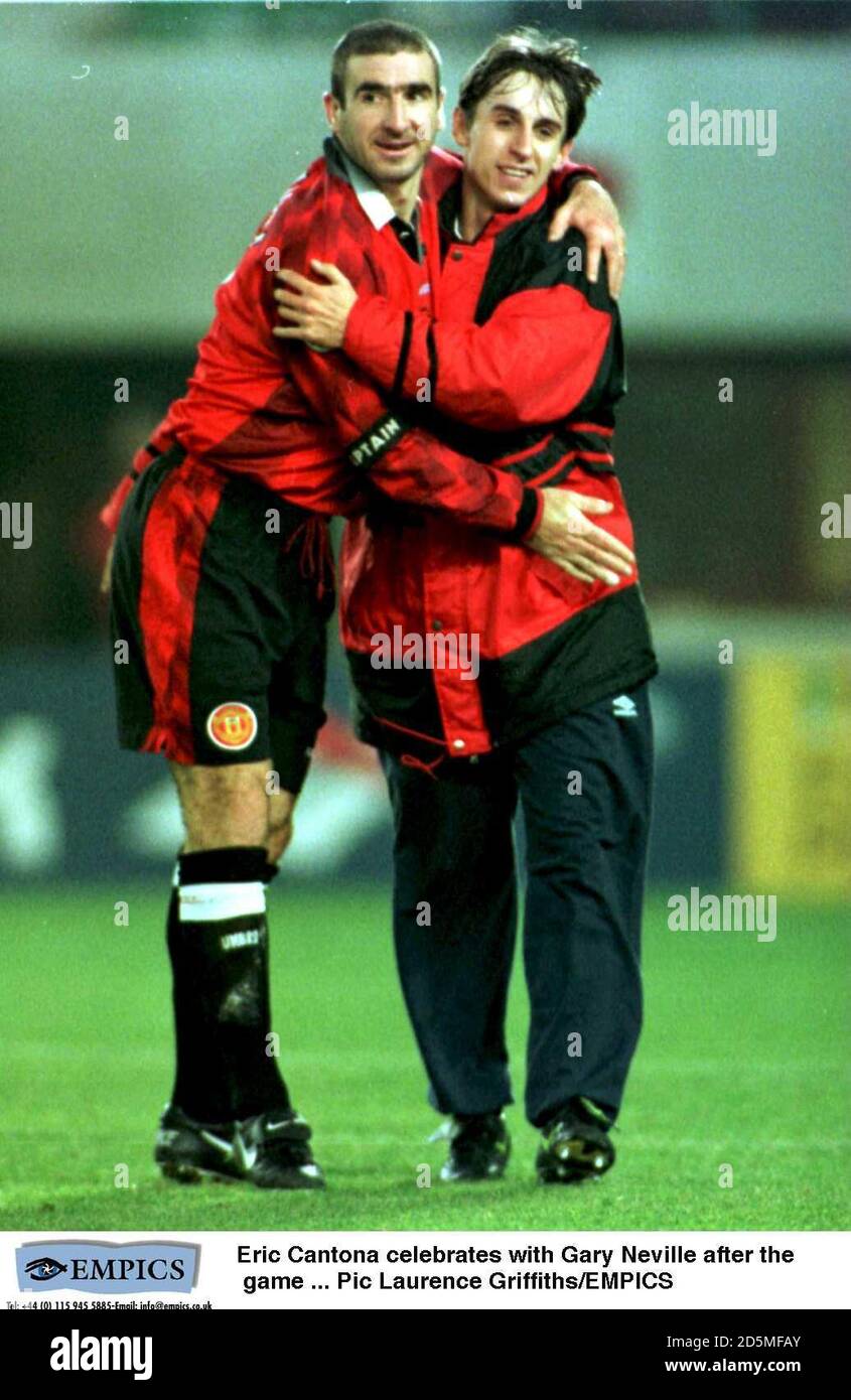 Eric Cantona celebrates with Gary Neville after the game Stock Photo