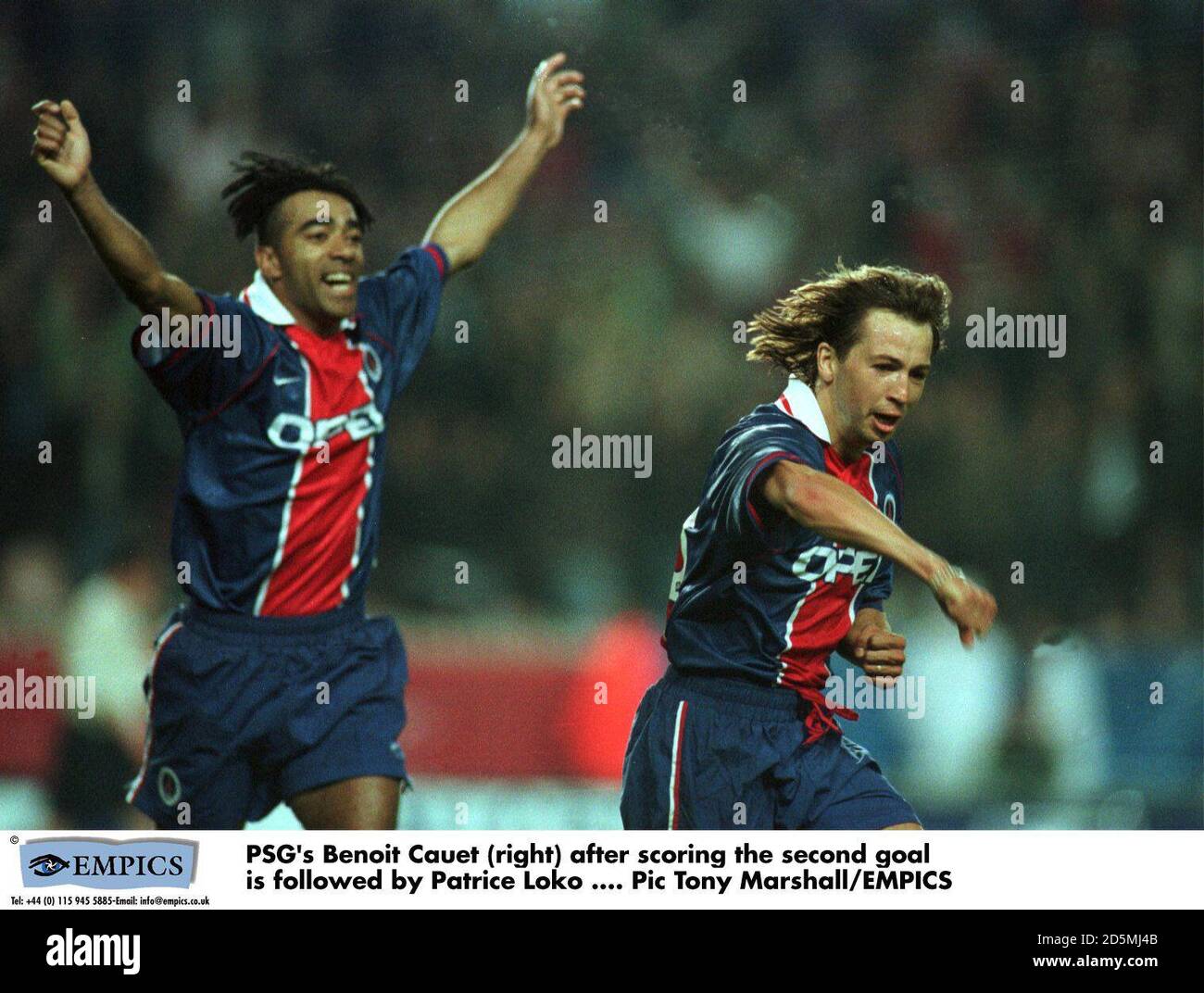 PSG's Benoit Cauet (right) after scoring the second goal is followed by Patrice Loko Stock Photo