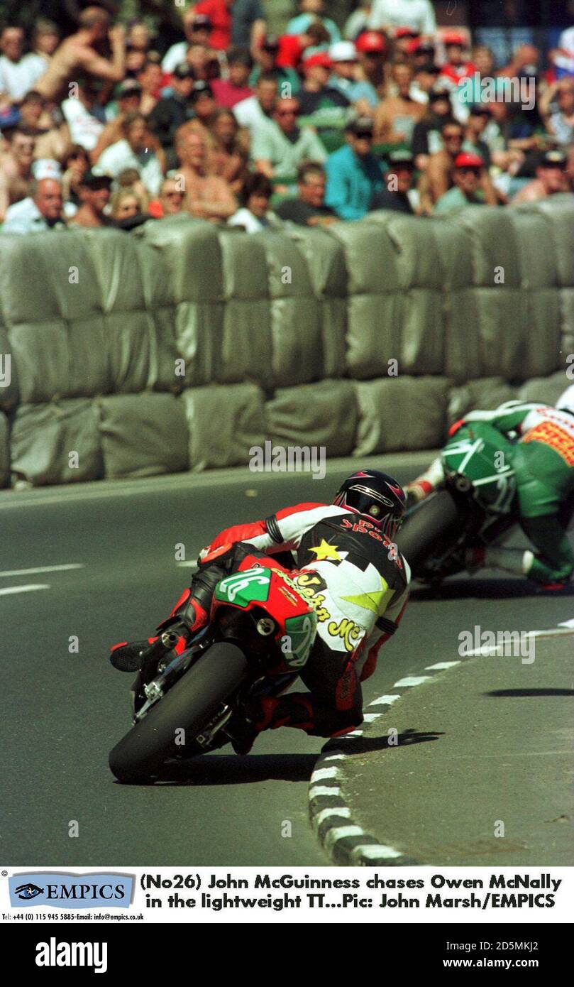 (No26) John McGuinness chases Owen McNally in the lightweight TT.   Stock Photo