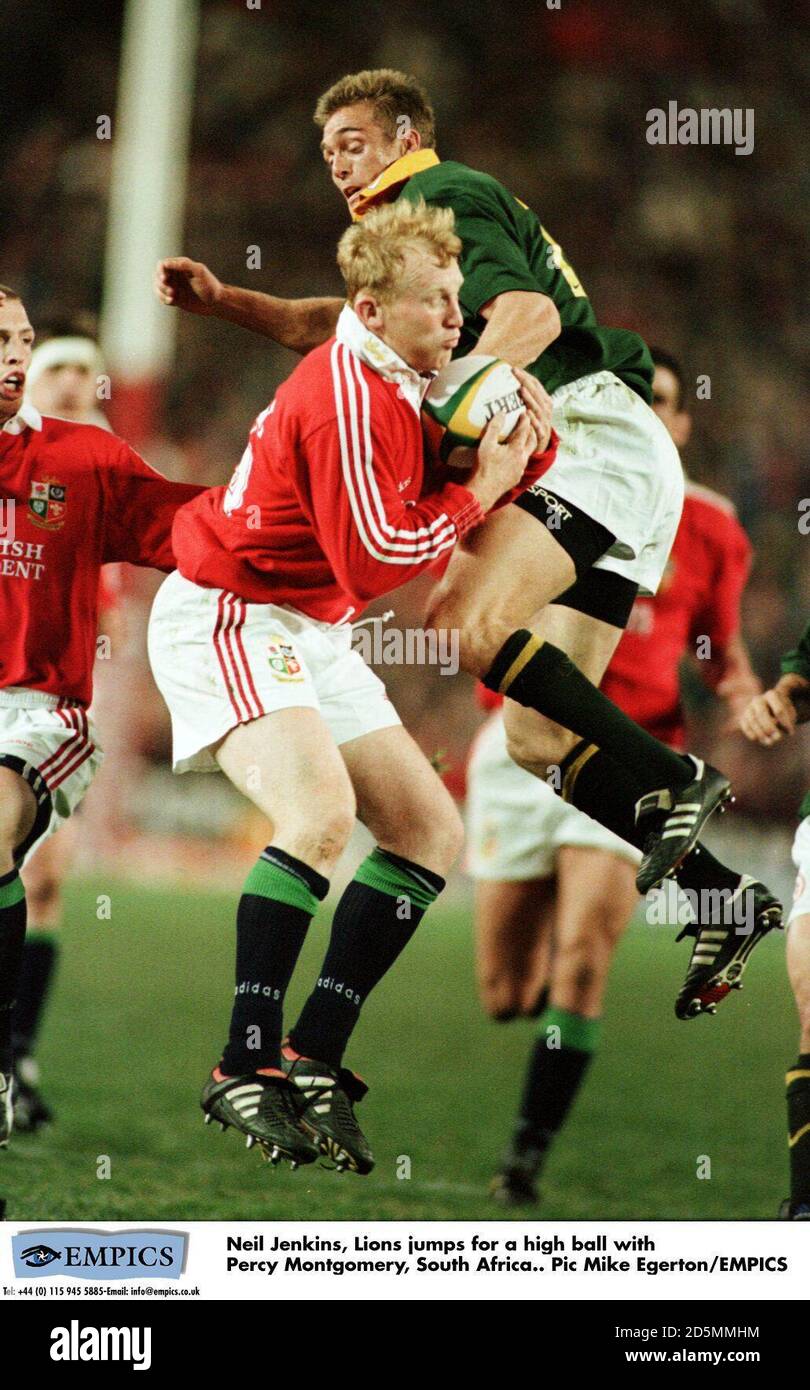 Neil Jenkins, Lions jumps for a high ball with Percy Montgomery, South ...