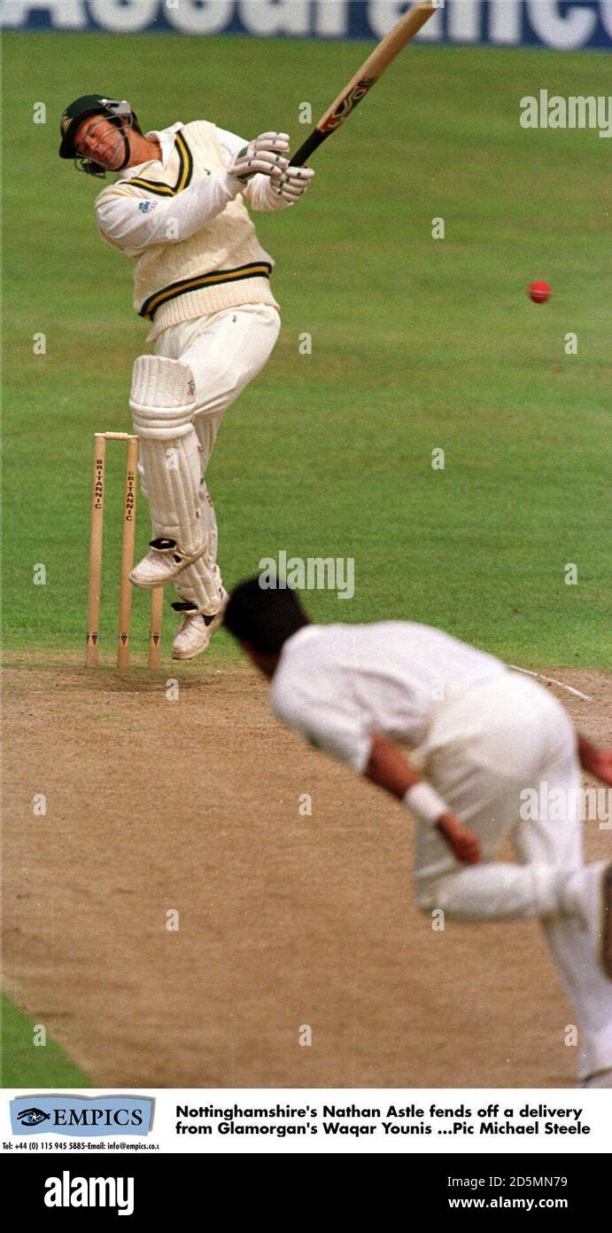 Nottinghamshire's Nathan Astle fends off a deliveryrfrom Glamorgan's Waqar Younis Stock Photo