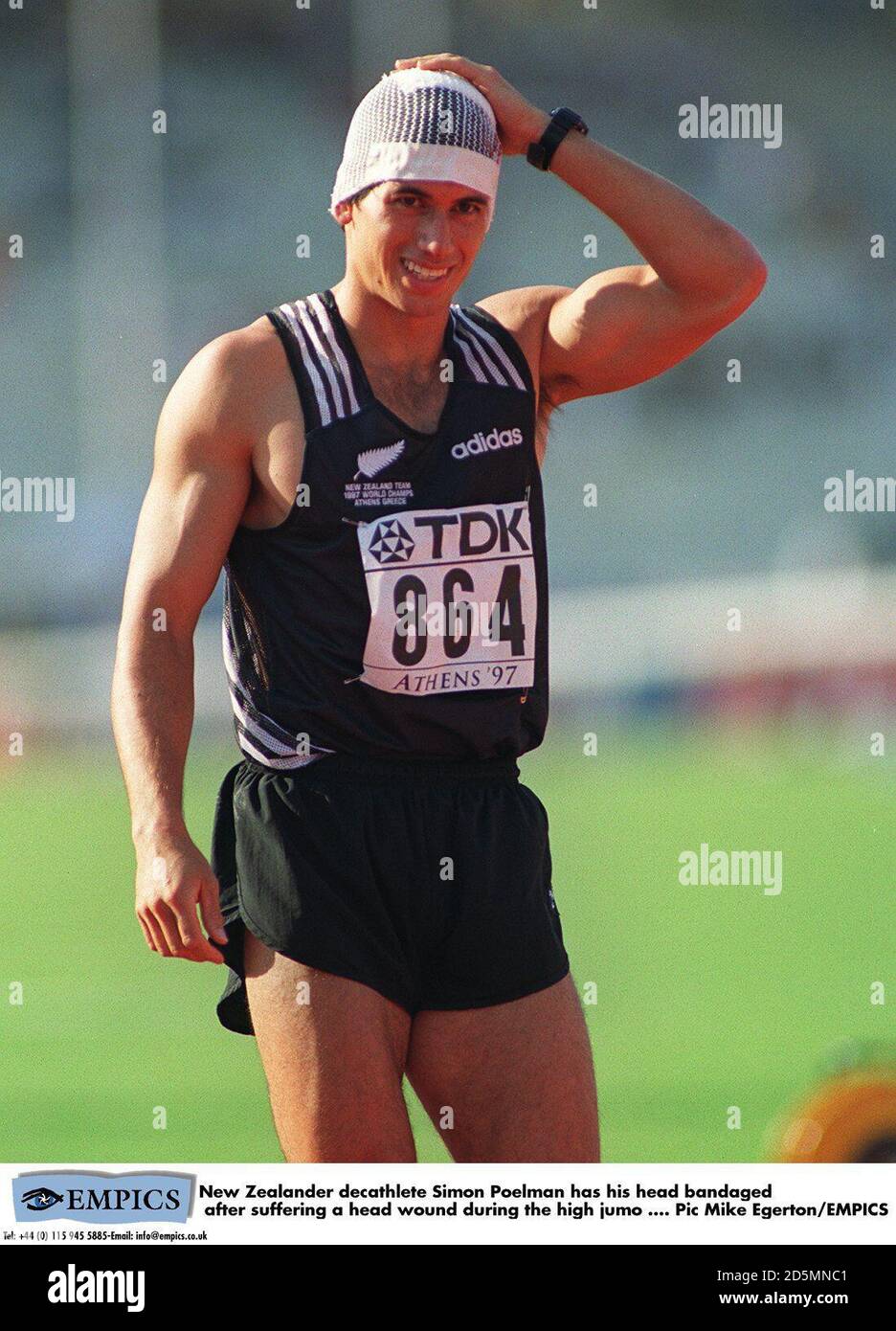 New Zealander decathlete Simon Poelman has his head banddaged after