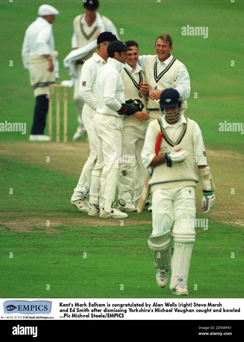 Kent's Mark Ealham (centre) is congratulated by Alan Wells (right), Steve Marsh (second from left) and Ed Smith (left) after dismissing Yorkshire's Michael Vaughan (front) caught and bowled Stock Photo