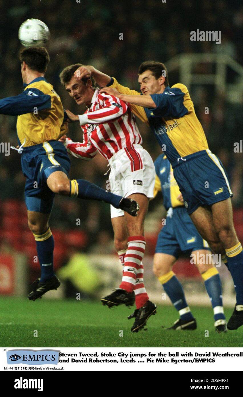 Steven Tweed of Stoke City (centre) is sandwiched by David Wetherall (right) and David Robertson (left) of Leeds United  Stock Photo