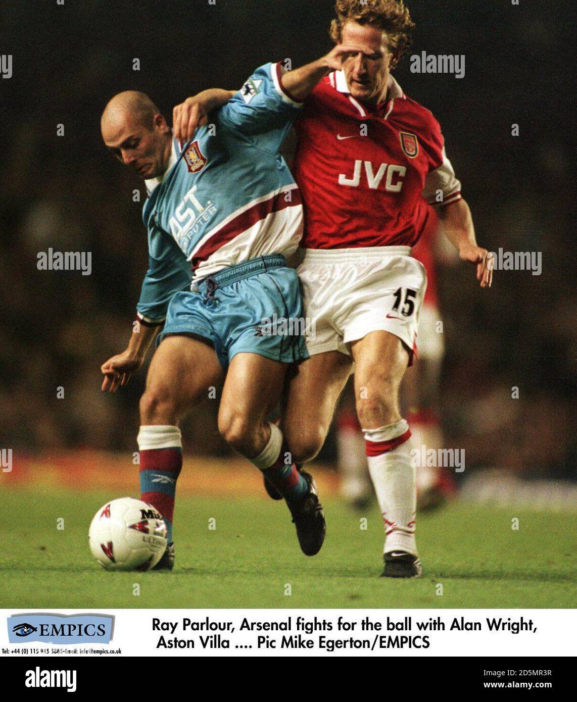 Ray Parlour of Arsenal (right) is held off by Alan Wright of Aston ...