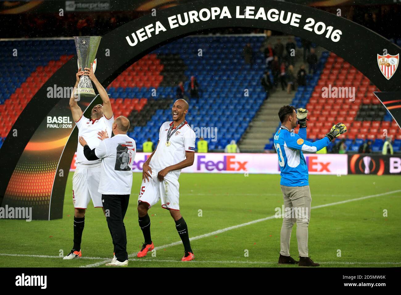 Sevilla's Adil Rami (left) and Steven Nzonzi (centre) celebrate with the Europa League trophy  Stock Photo