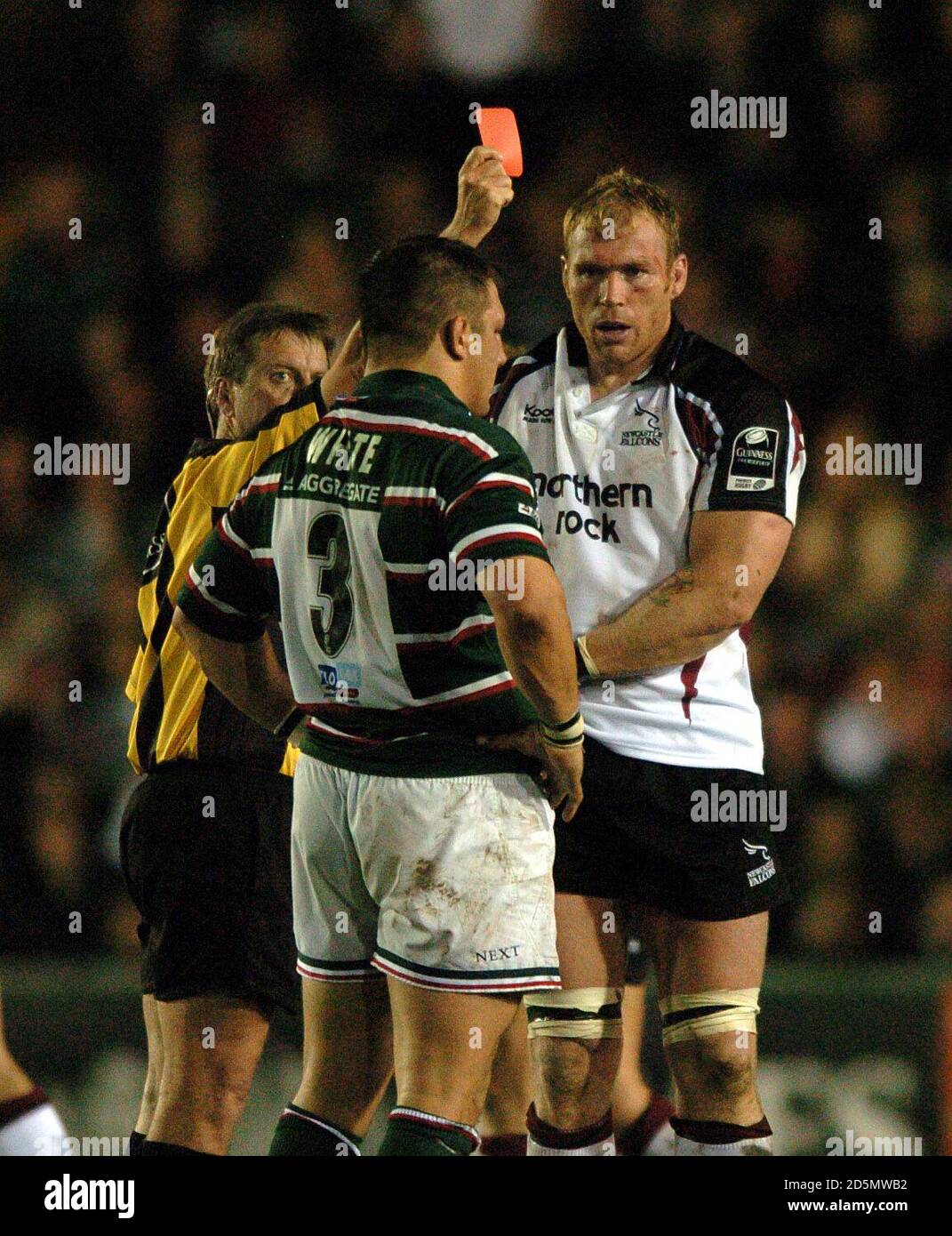 Referee Tony Spreadbury shows the red card to Leicester Tigers' Julian ...