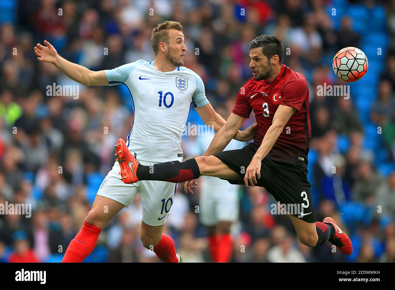 England's Harry Kane and Turkey's Hakan Kadir Balta battle for the ball Stock Photo