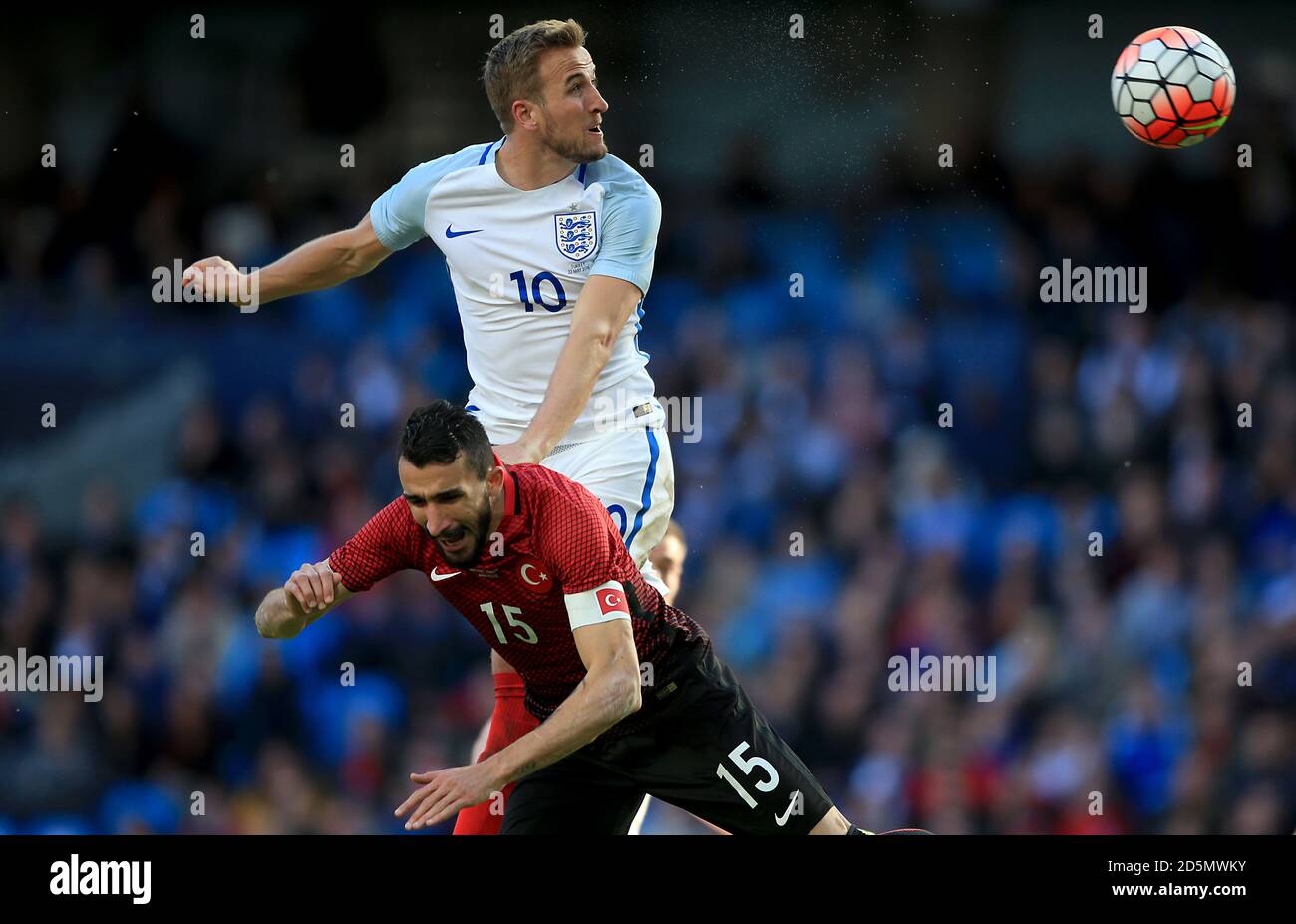 Turkey's Mehmet Topal and England's Harry Kane battle for the ball in the air  Stock Photo