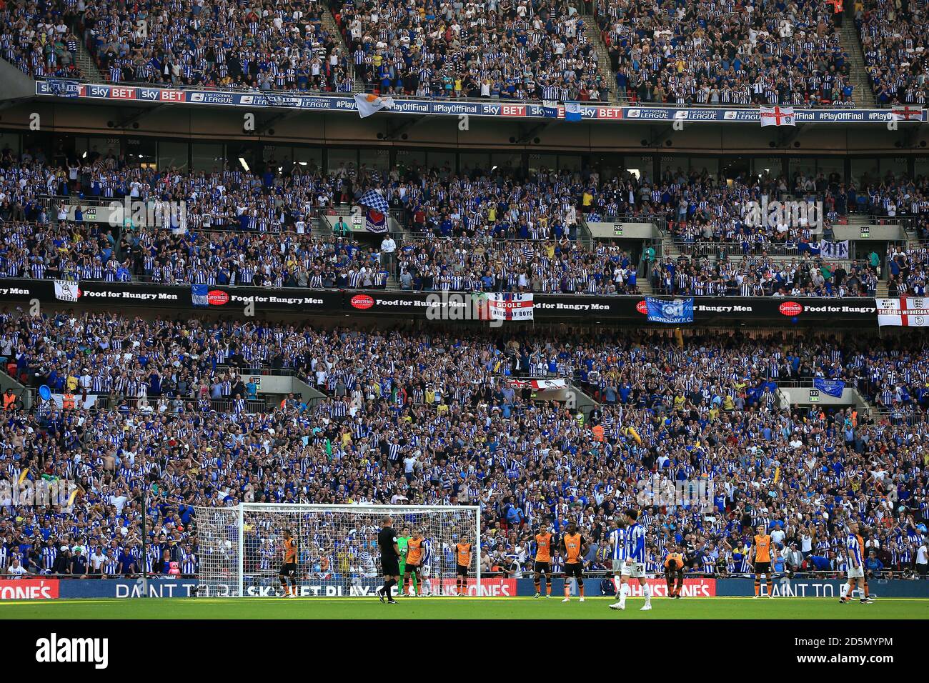 Sheffield Wednesday fans in the stands watch the action at Wembley