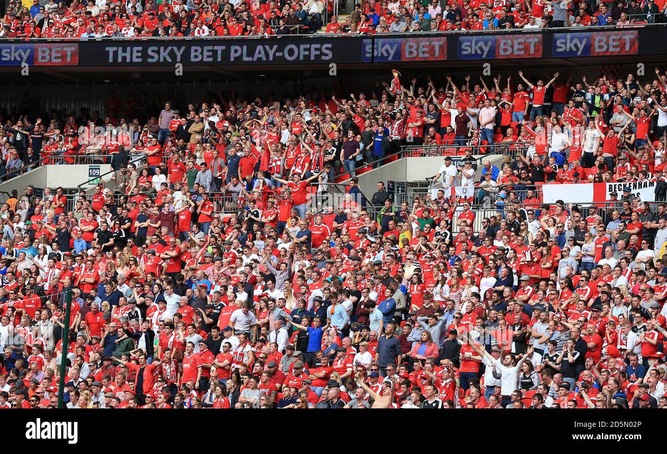 Barnsley fans cheer on their side from the stands Stock Photo Alamy