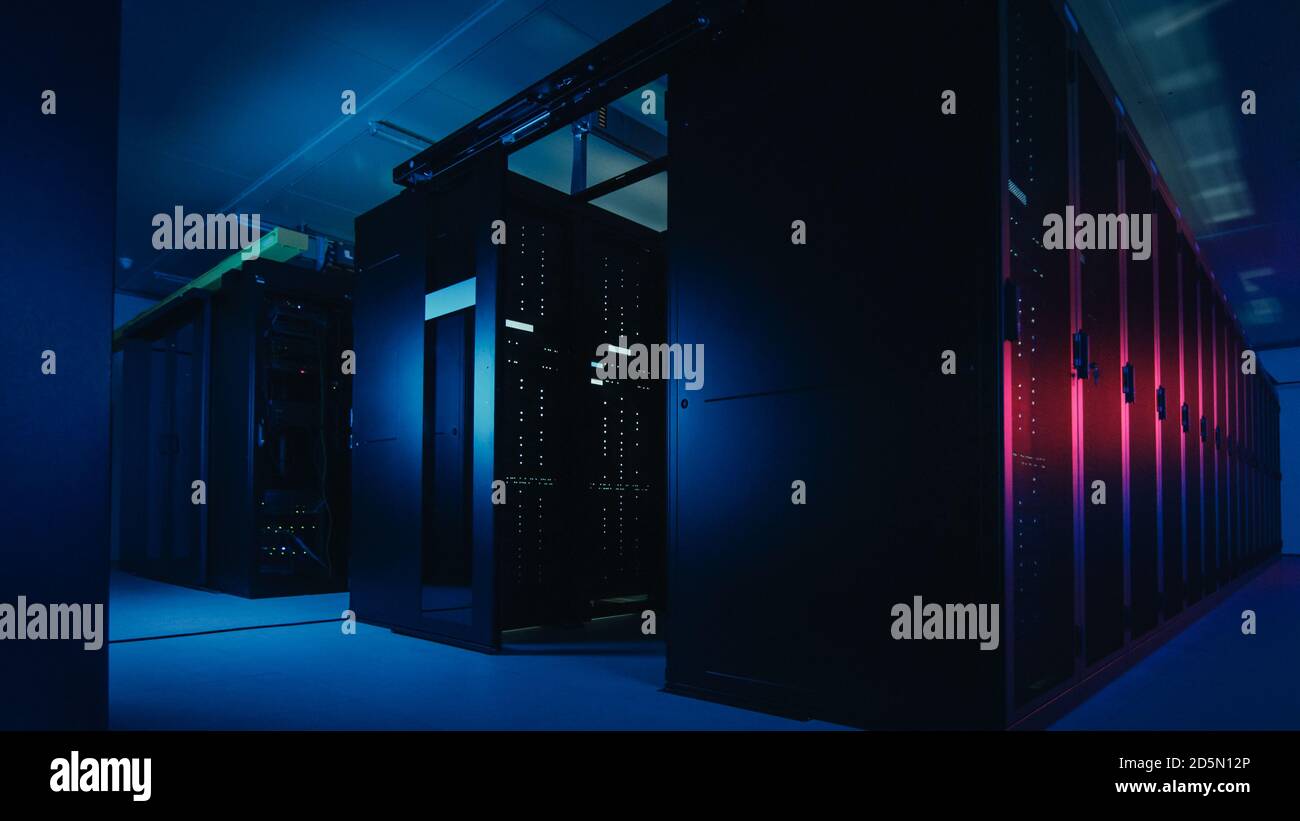 Shot of Data Center With Multiple Rows of Fully Operational Server Racks. Modern Telecommunications, Cloud Computing, Artificial Intelligence Stock Photo