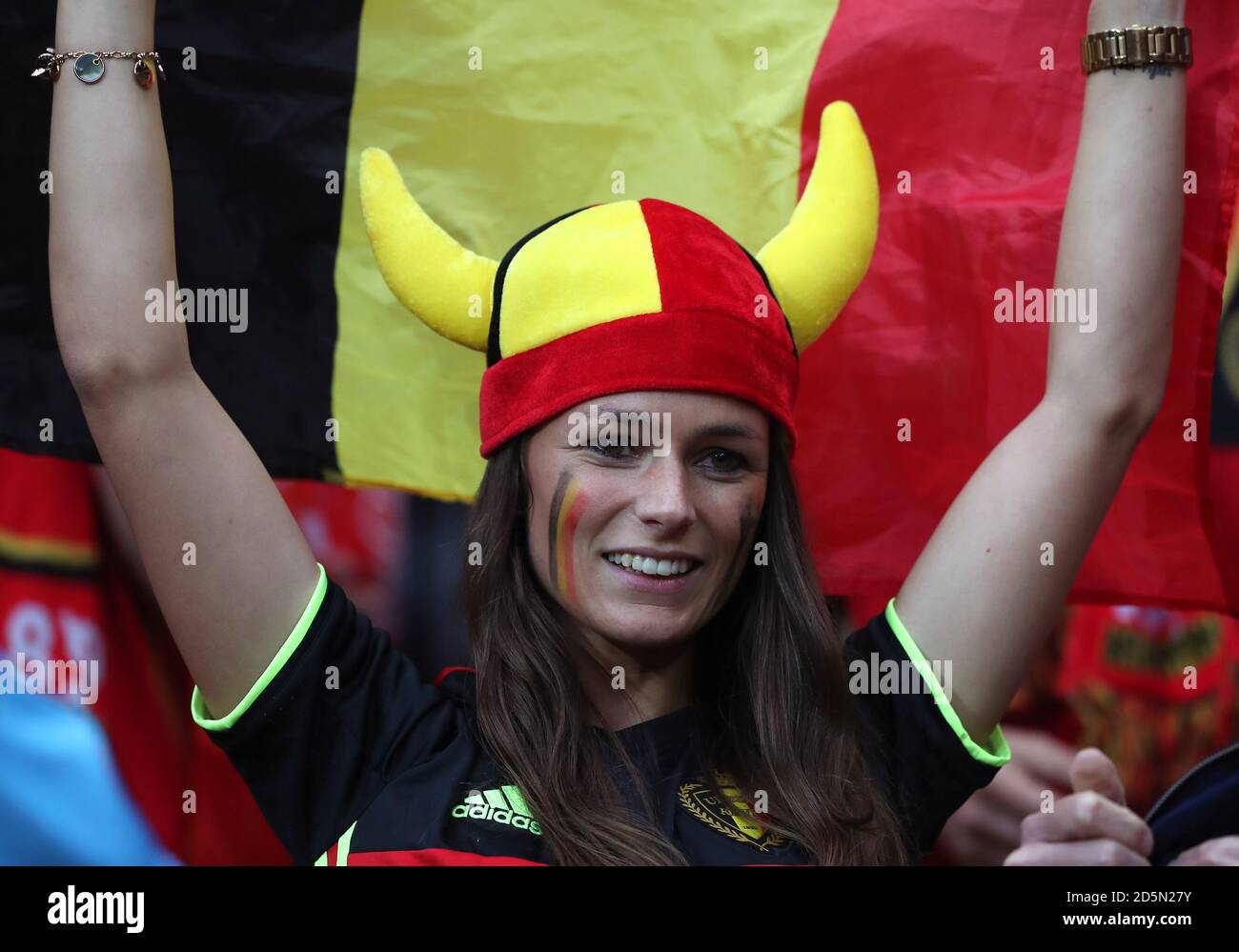 A Belgium supporter shows her support in the stands during the game  Stock Photo