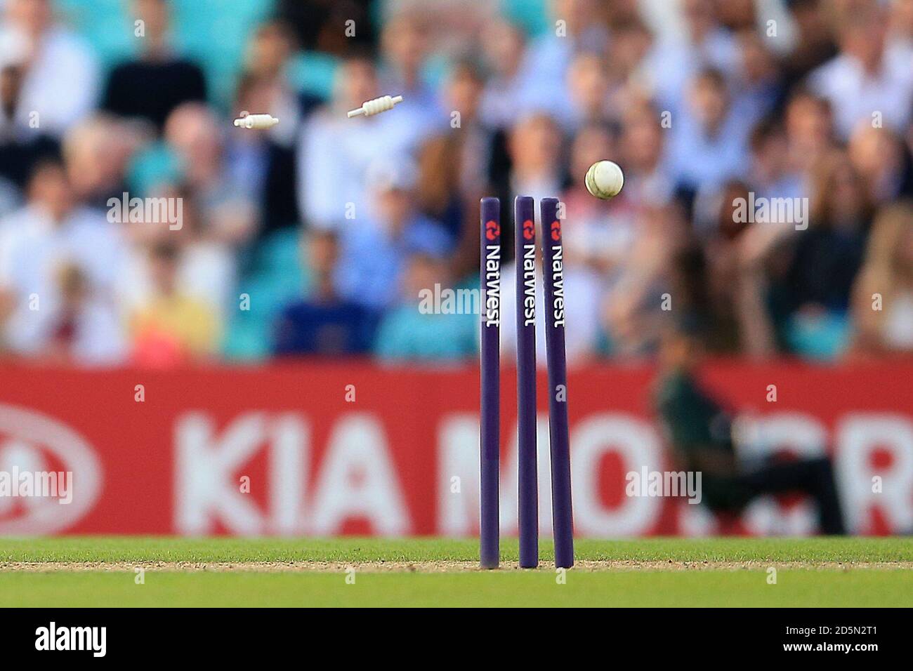 A view of Bales being knocked off a set if Natwest branded cricket stumps  Stock Photo