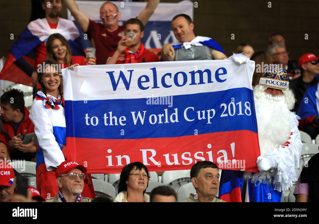Russia fans hold up a flag reading 'Welcome to the World Cup 2018 in Russia!' Stock Photo
