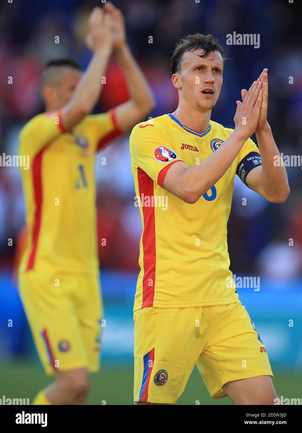 Romania's Vlad Chiriches applauds supporters after the final whistle  Stock Photo